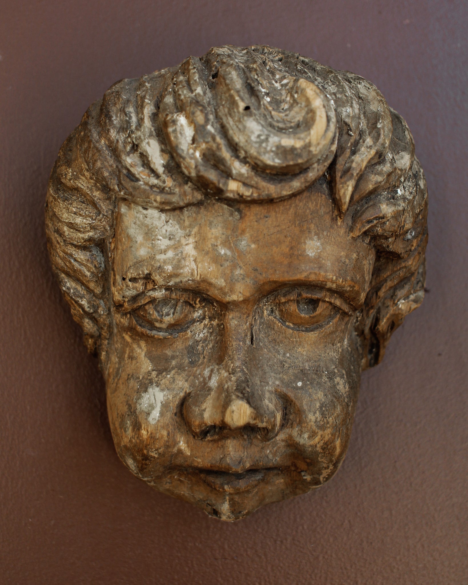 Carved Cherub’s Head with Polychrome Remnants