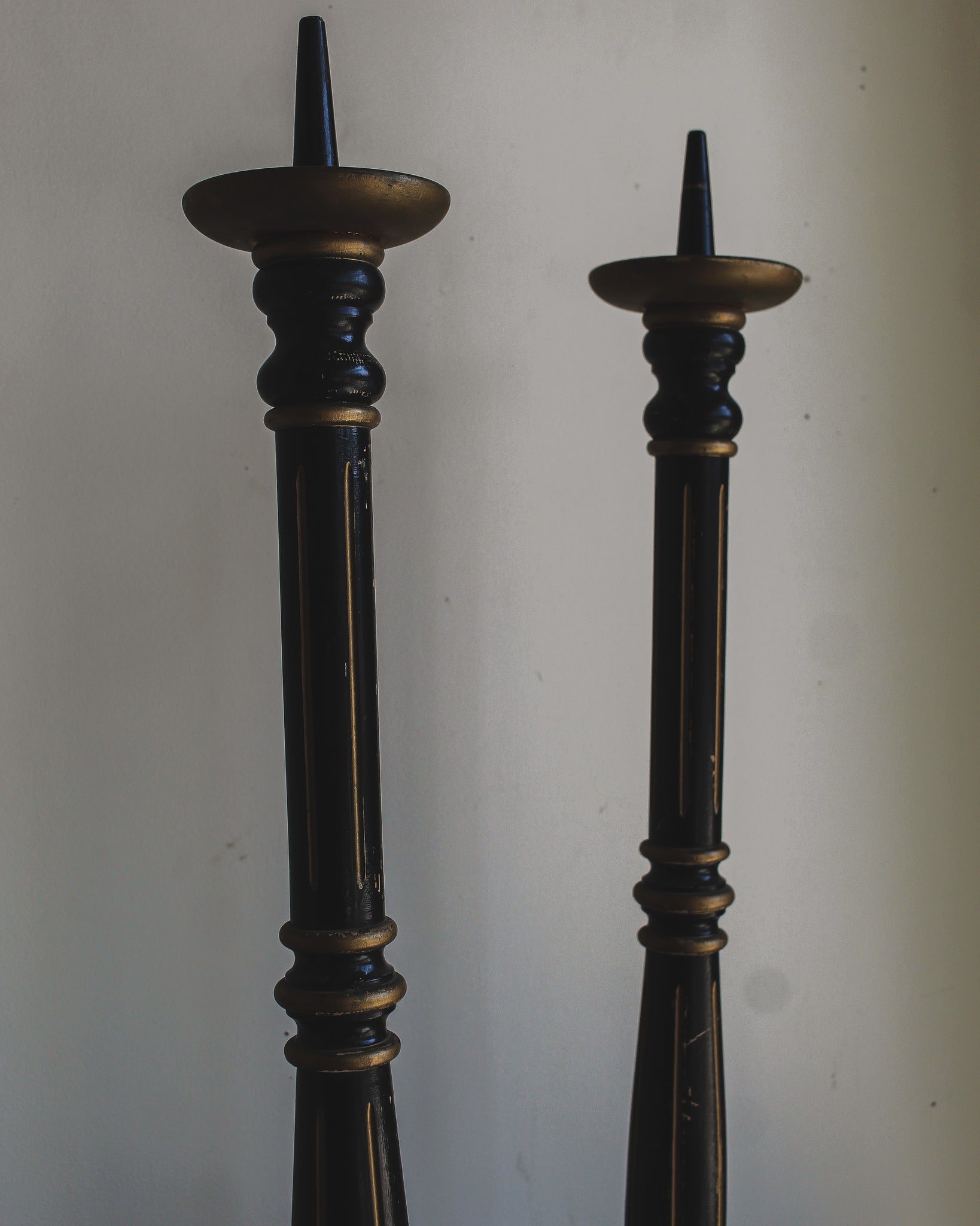 Tall Black and Gold Candlestick Pair